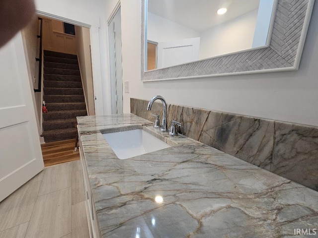 interior space featuring sink and light hardwood / wood-style flooring