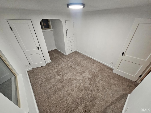 unfurnished bedroom with light carpet