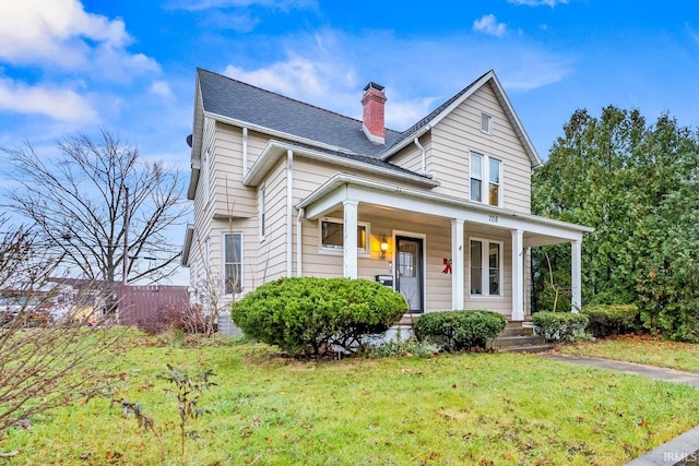 view of front of home with a porch and a front lawn