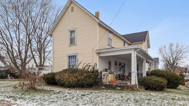 rear view of property with a patio