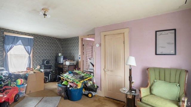 living area with light colored carpet