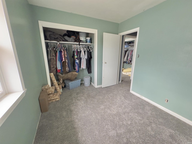 carpeted bedroom with a closet