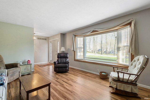 sitting room featuring light hardwood / wood-style floors and a wealth of natural light