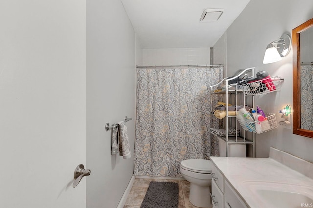 bathroom with tile patterned flooring, vanity, a shower with shower curtain, and toilet