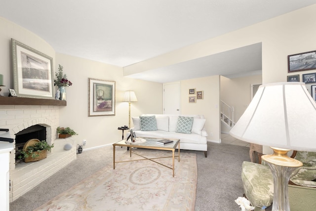 living room with a fireplace and light carpet