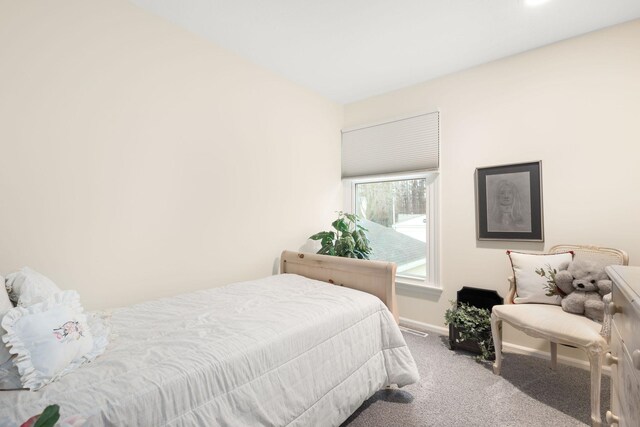 bedroom featuring light carpet