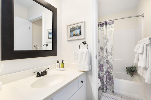 full bathroom featuring tile patterned flooring, shower / tub combo with curtain, vanity, and toilet