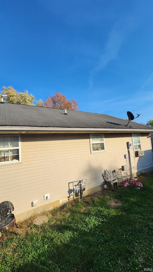 view of property exterior featuring a lawn