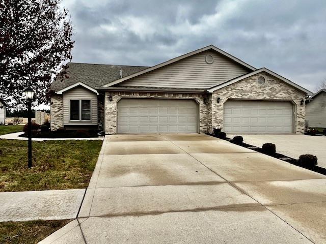 single story home featuring a garage