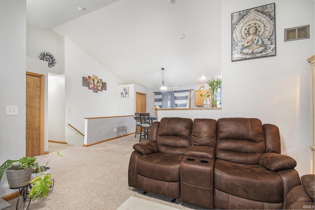 carpeted living room with lofted ceiling and a chandelier