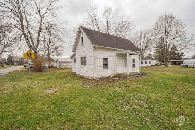 view of property exterior featuring a lawn