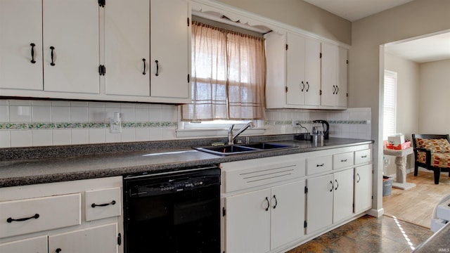 7111 Upton Rd, Mount Vernon, IN 47620 - kitchen with white cabinets, black dishwasher, backsplash, and sink