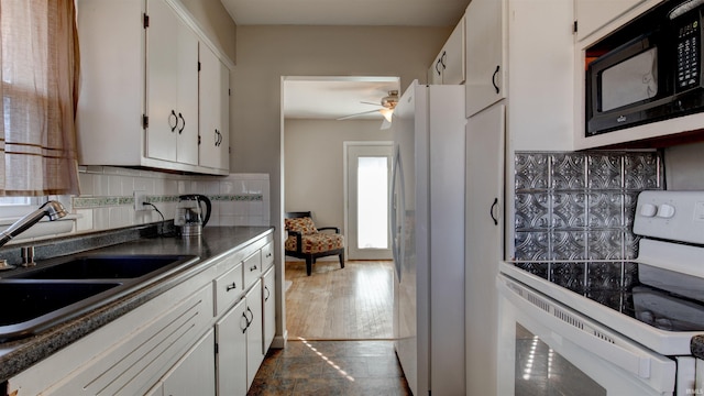 7111 Upton Rd, Mount Vernon, IN 47620 - kitchen with black microwave, sink, white refrigerator with ice dispenser, stove, and white cabinets