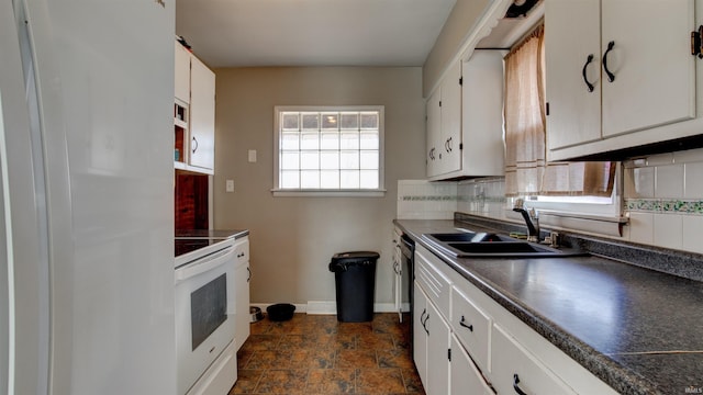 7111 Upton Rd, Mount Vernon, IN 47620 - kitchen with white cabinets, decorative backsplash, and range
