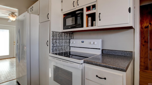 7111 Upton Rd, Mount Vernon, IN 47620 - kitchen featuring white appliances, tasteful backsplash, white cabinetry, and light hardwood / wood-style flooring