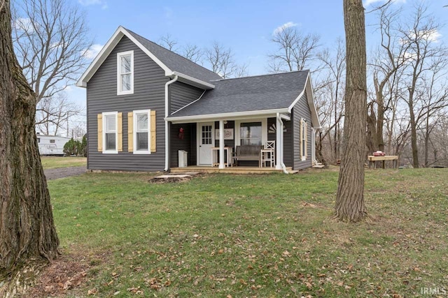 view of front of house featuring a front lawn and covered porch