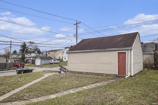 garage featuring a lawn