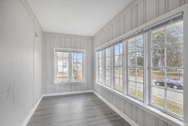 unfurnished sunroom with a healthy amount of sunlight