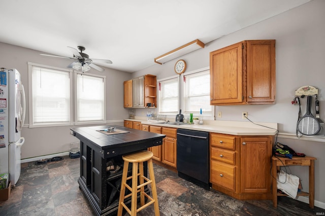 kitchen with ceiling fan, sink, black dishwasher, a kitchen breakfast bar, and white refrigerator