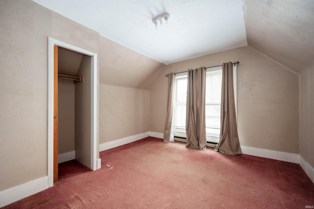 bonus room featuring carpet flooring and vaulted ceiling