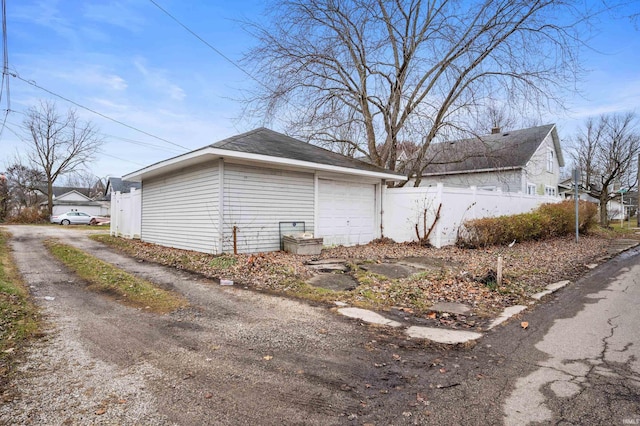 exterior space with an outdoor structure and a garage