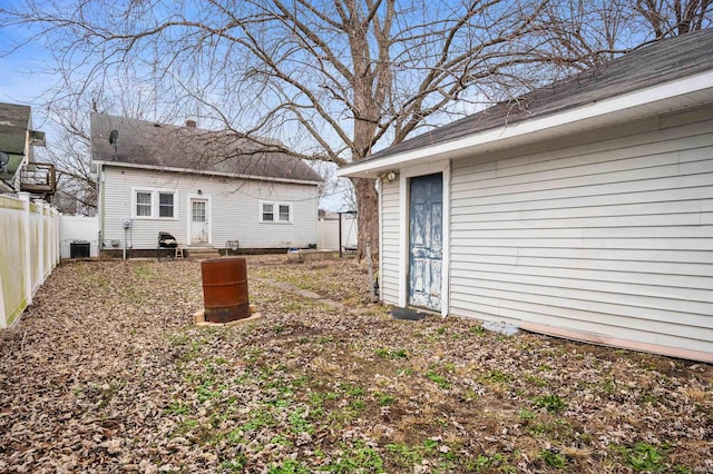 exterior space featuring an outdoor structure and central AC