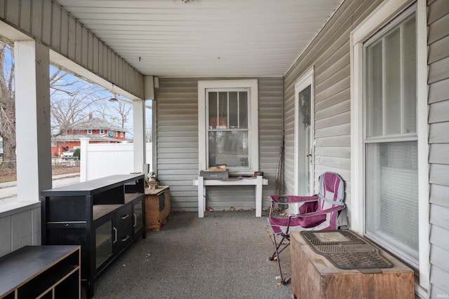 sunroom / solarium featuring a healthy amount of sunlight