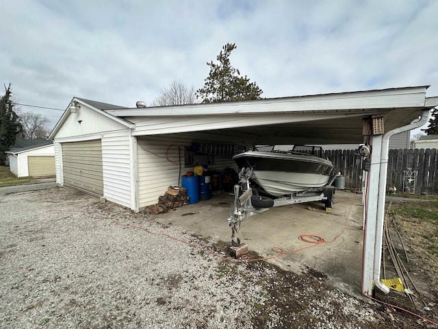 view of parking featuring a carport and a garage