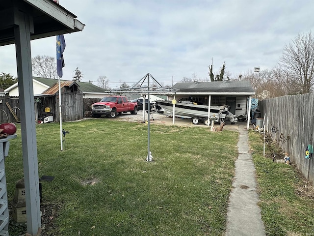 view of car parking featuring a lawn and a carport