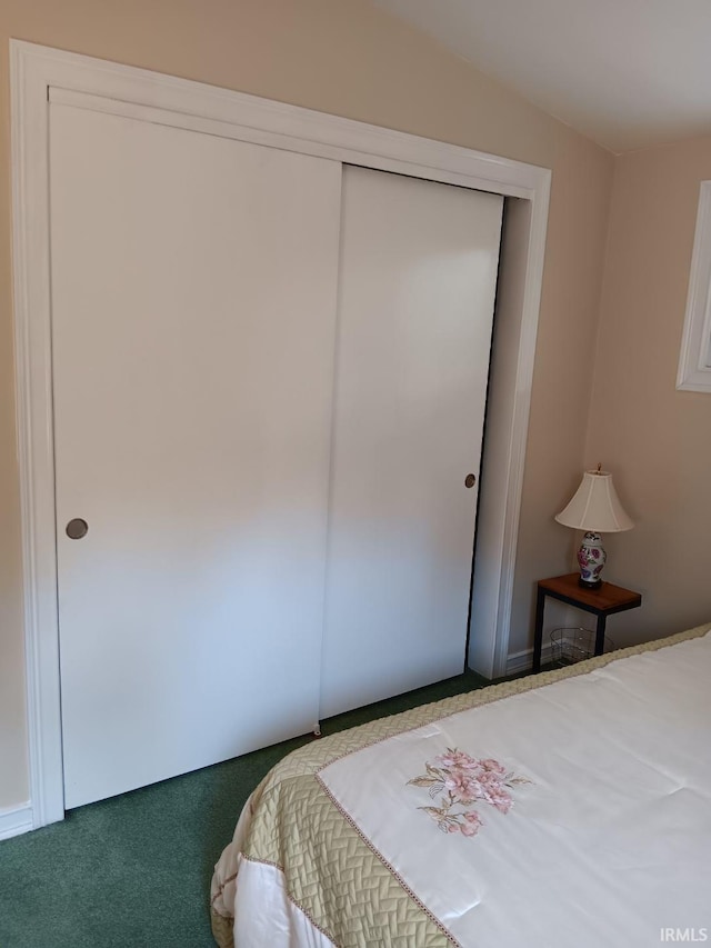 carpeted bedroom with a closet