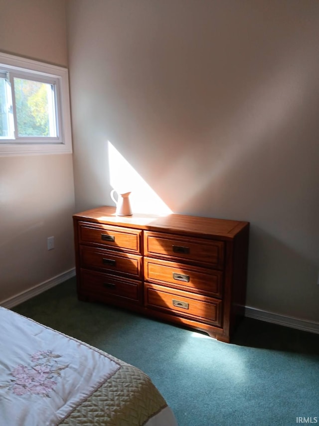 bedroom featuring dark colored carpet