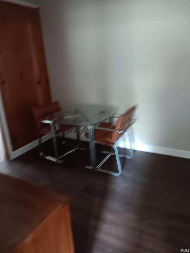 unfurnished dining area featuring dark hardwood / wood-style floors