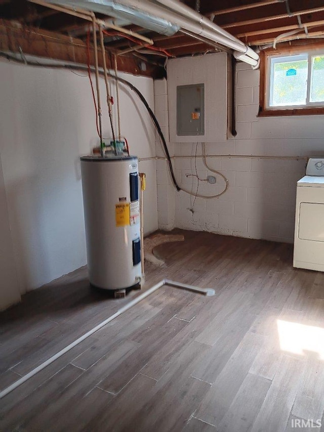 interior space featuring washer / dryer, wood-type flooring, electric panel, and water heater