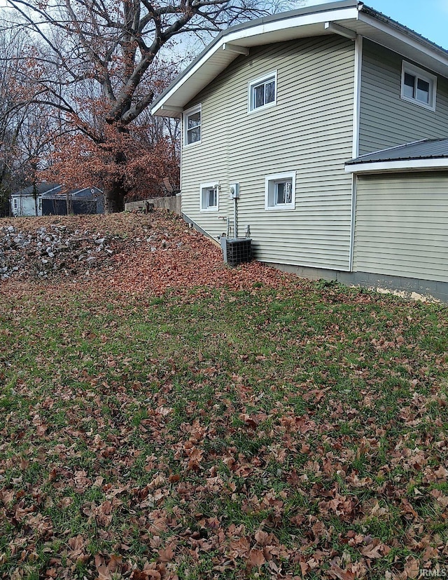 view of side of property with central AC