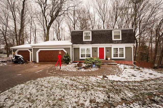 cape cod house with a garage