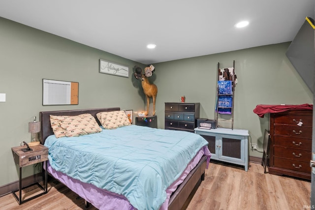 bedroom with light hardwood / wood-style flooring