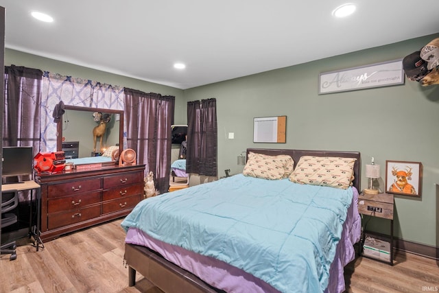 bedroom with light hardwood / wood-style flooring