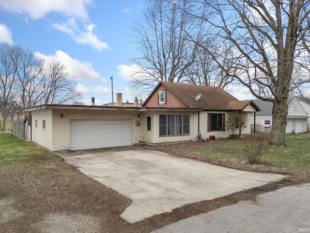 ranch-style home with a front yard and a garage