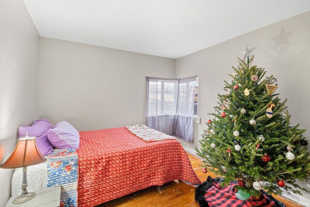 bedroom with wood-type flooring