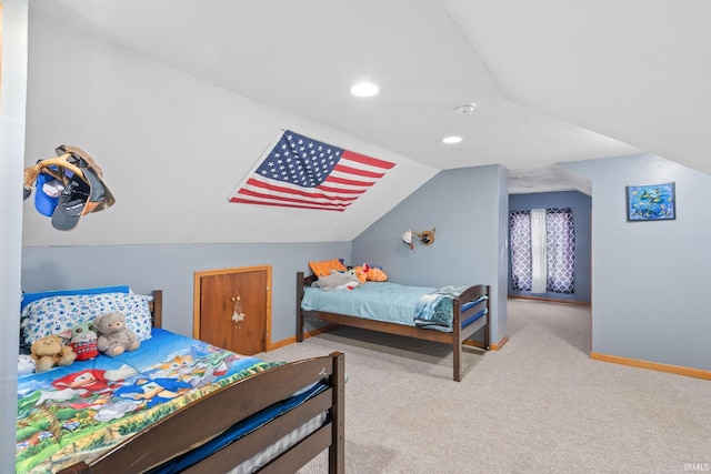 carpeted bedroom featuring vaulted ceiling