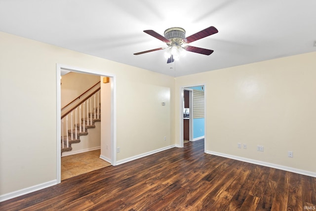 unfurnished room featuring dark hardwood / wood-style floors and ceiling fan