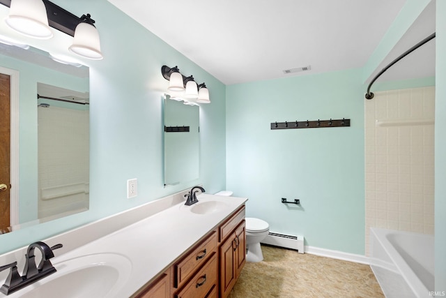 full bathroom featuring vanity, tile patterned floors, tiled shower / bath, toilet, and baseboard heating