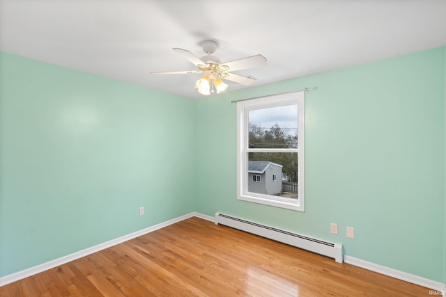 unfurnished room with baseboard heating, ceiling fan, and light hardwood / wood-style flooring