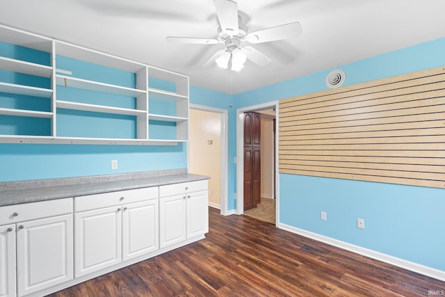 kitchen featuring white cabinets, ceiling fan, and dark wood-type flooring