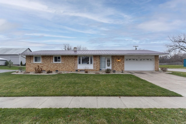 ranch-style house featuring a front lawn and a garage