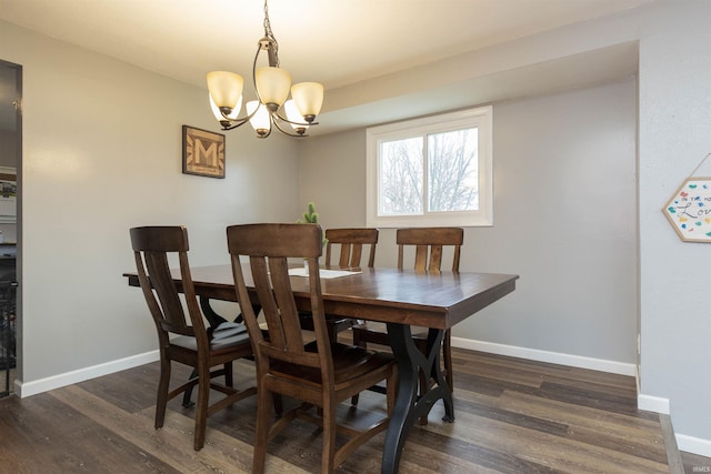 dining space featuring a notable chandelier and dark hardwood / wood-style floors