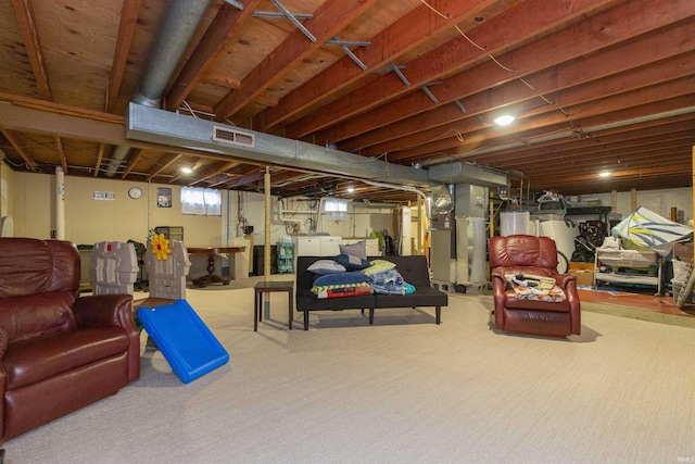 basement with heating unit, water heater, and light carpet