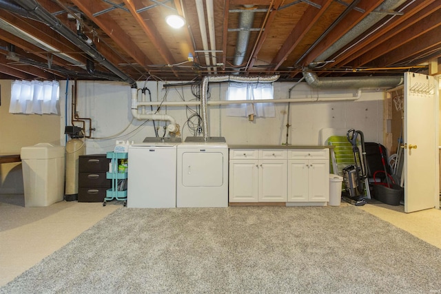 basement with independent washer and dryer, light colored carpet, and a healthy amount of sunlight