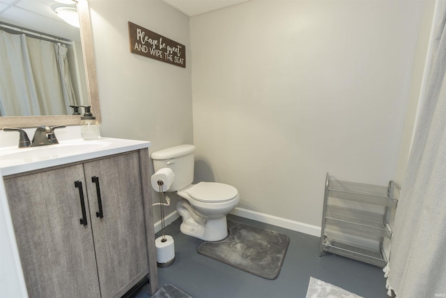 bathroom featuring vanity, toilet, and concrete floors