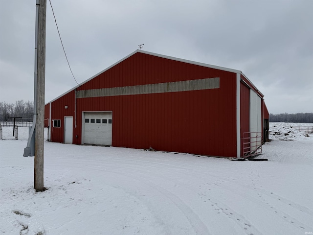 view of snow covered garage